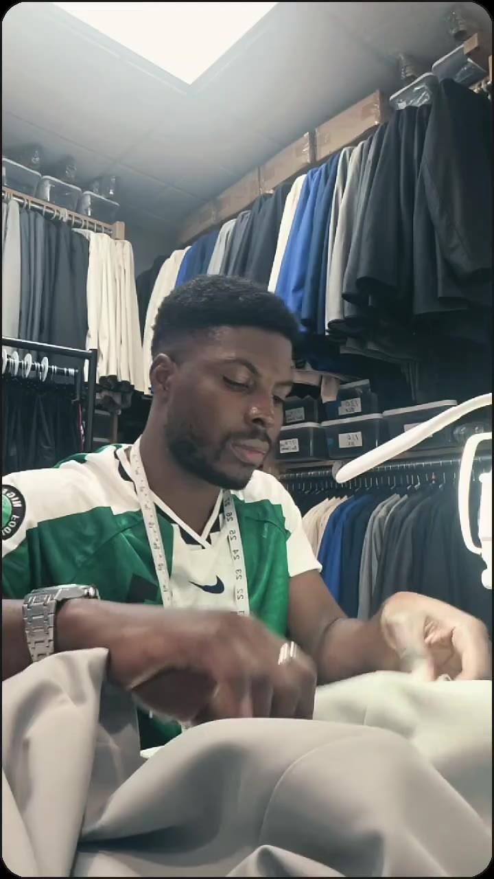 Tailor at work in the DXA STITCH workroom